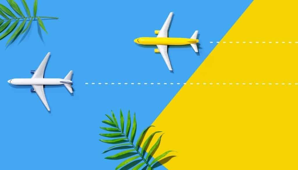 Two toy airplanes glide over a vibrant yellow and blue background, one white and one yellow, with tropical leaves adorning the corners. A dotted line indicates movement, capturing the essence of travel and clever design in modern travel technology.