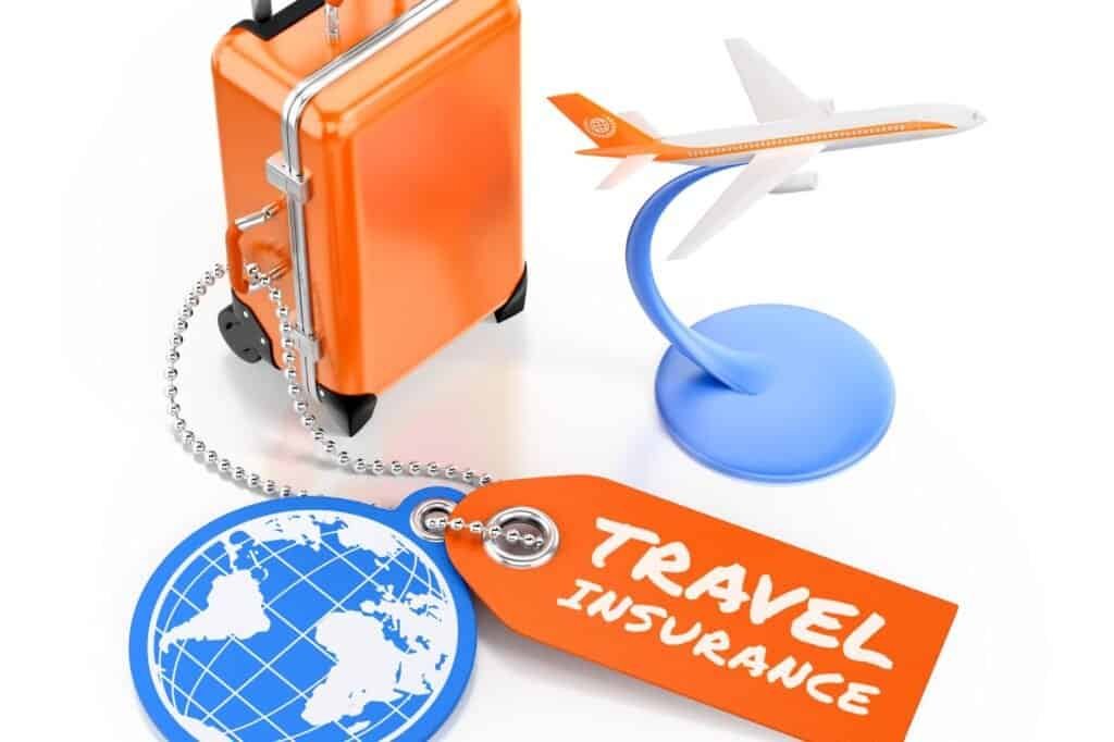 Orange suitcase and travel insurance tag with a globe and model airplane, ensuring you stay healthy while traveling.